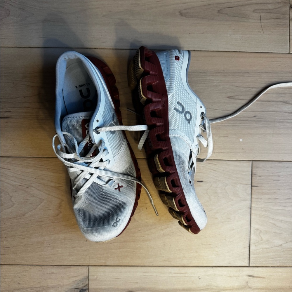 On Running White and Red Athletic Shoes